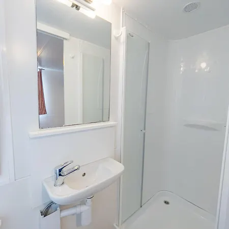 Punta Falconera & Village